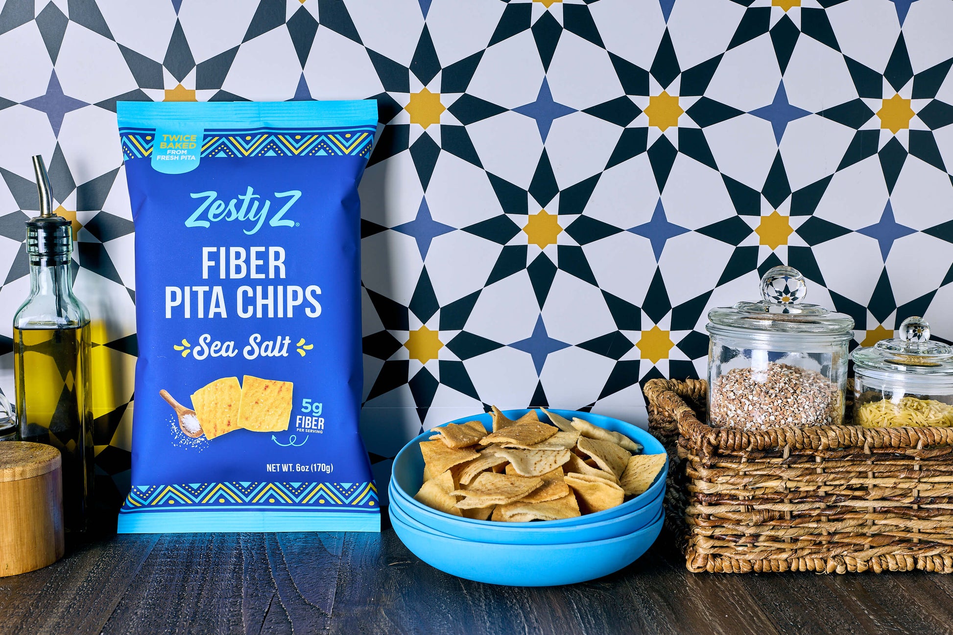 Zesty Z Fiber Pita Chips packaging with chips in a bowl on a patterned wall background