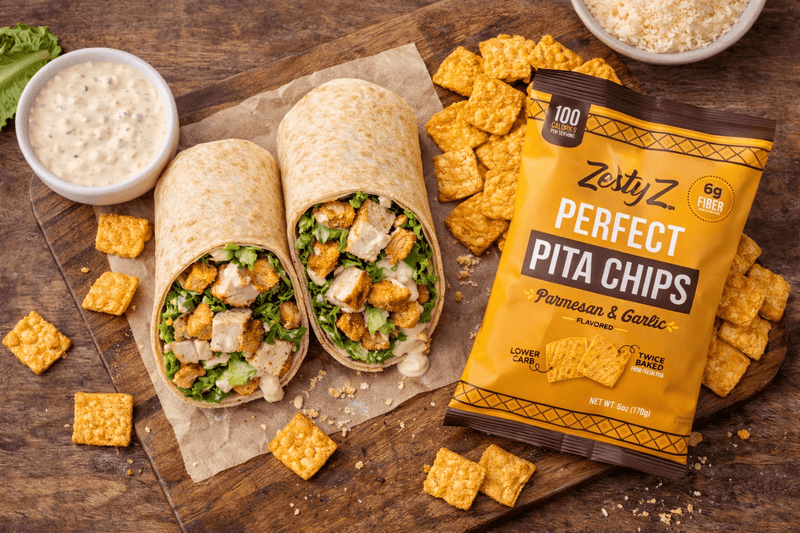 Chicken Caesar wraps with romaine lettuce, parmesan cheese, Greek yogurt, and High Fiber Pita Chips
